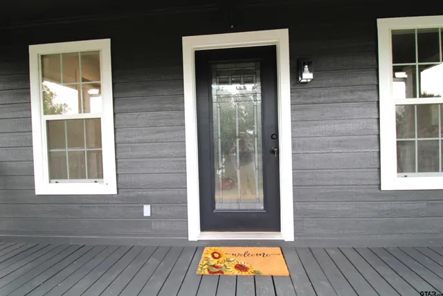 a view of outdoor space and wooden floor