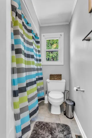 a bedroom with furniture and a book shelf