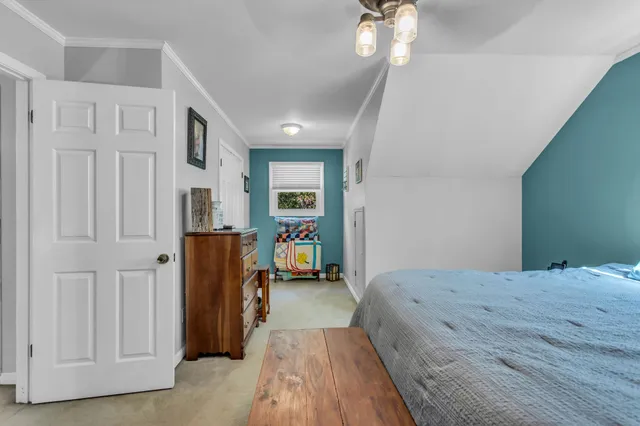 a backyard of a house with barbeque oven table and chairs