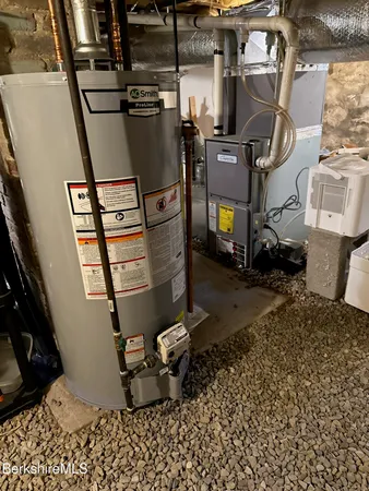 a room with water heater and storage