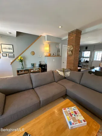 a living room with furniture and a rug