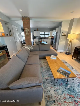 a living room with furniture and a rug