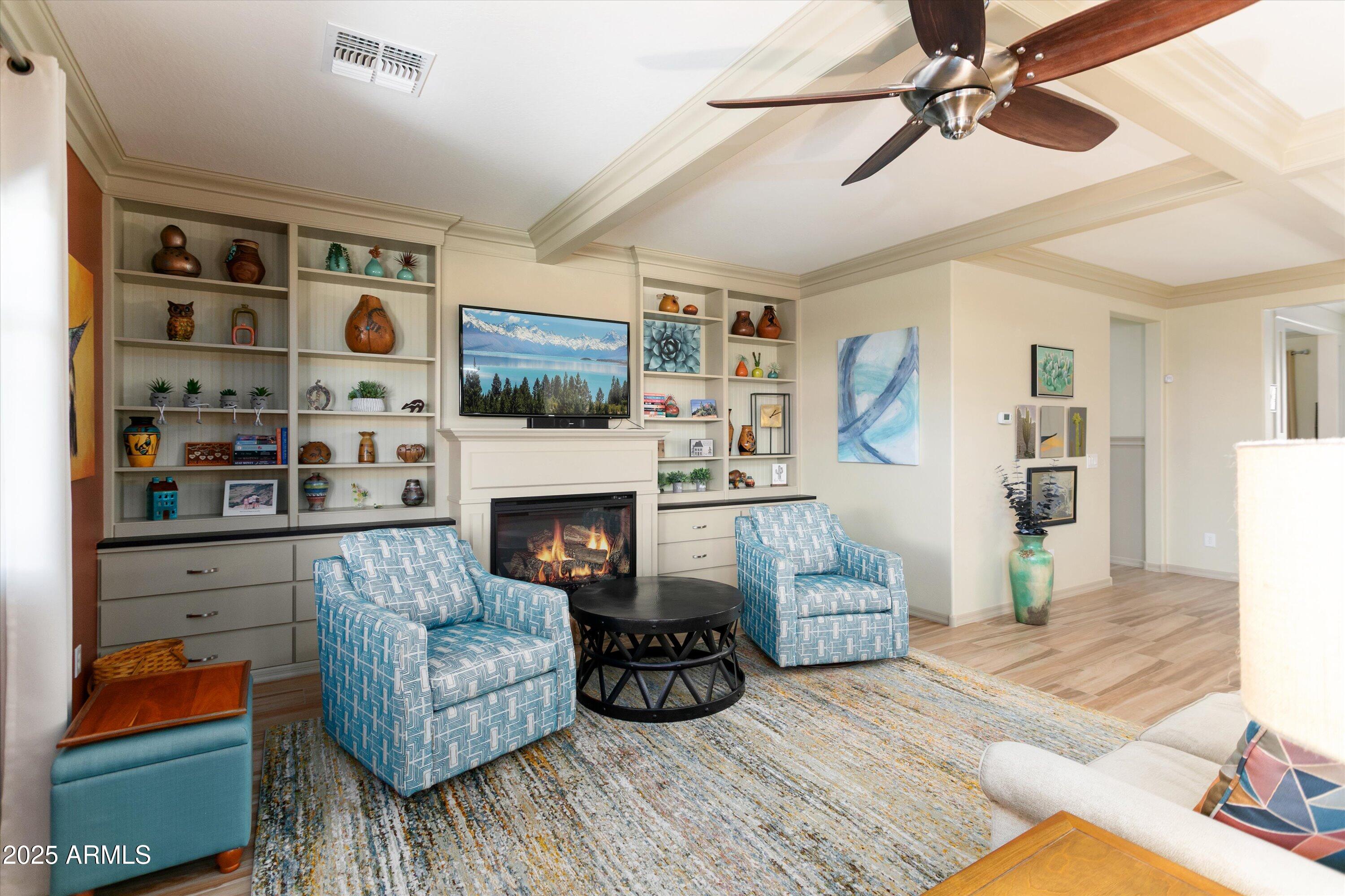 3197 North Springfield Street Buckeye, AZ 85396 - Photo 10 of 60 a living room with furniture and a fireplace