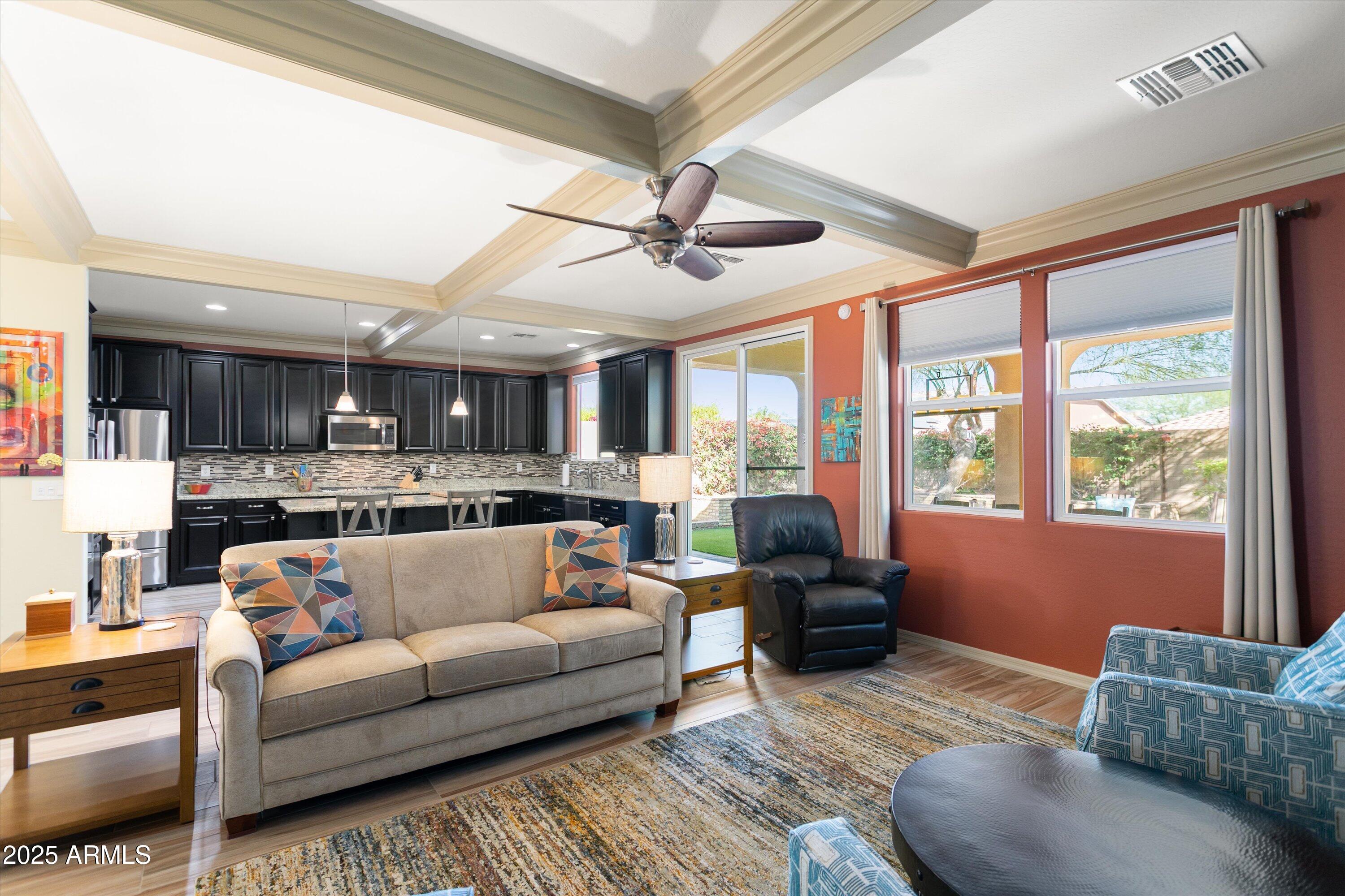 3197 North Springfield Street Buckeye, AZ 85396 - Photo 11 of 60 a living room with furniture and a large window