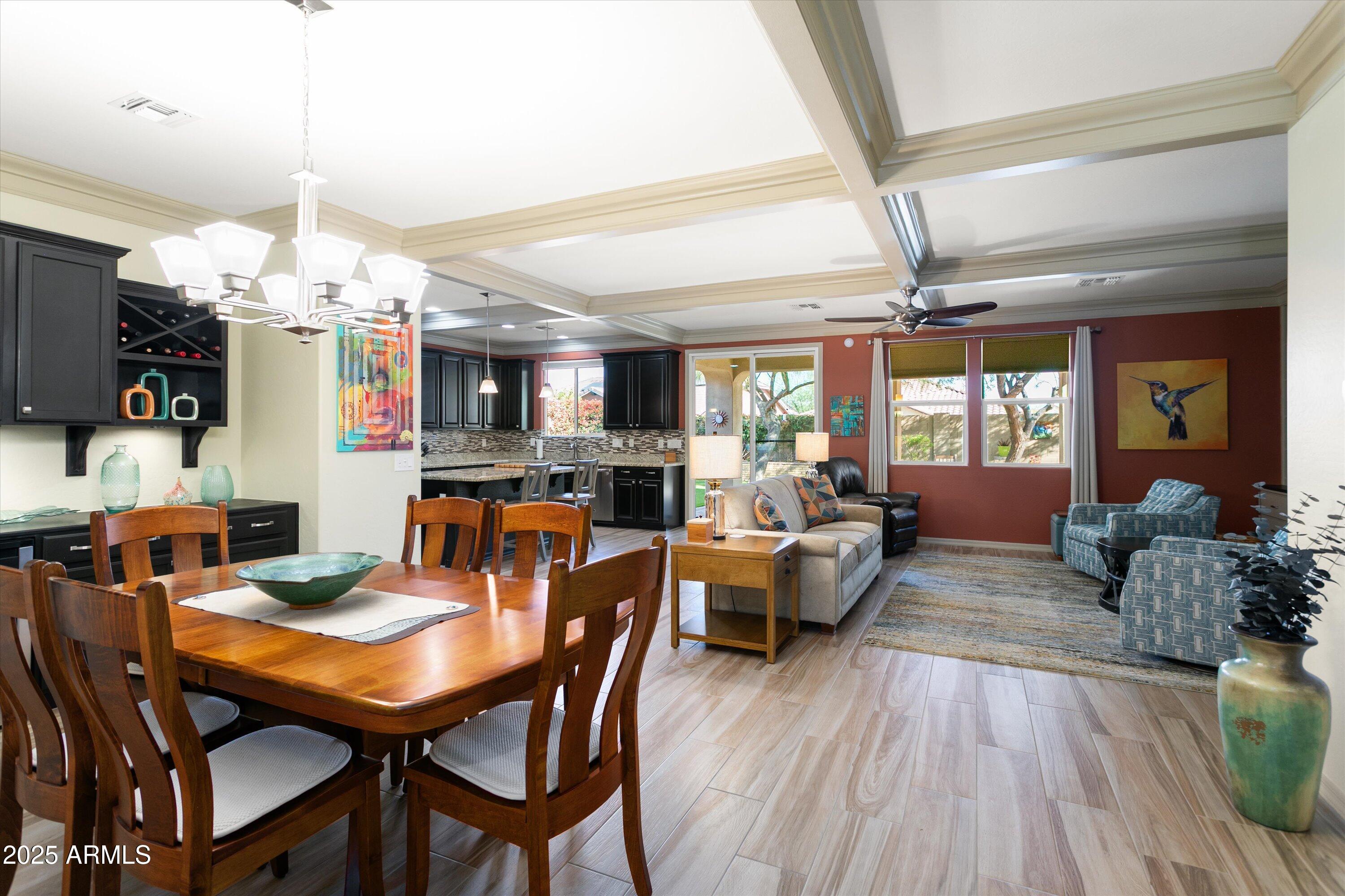3197 North Springfield Street Buckeye, AZ 85396 - Photo 21 of 60 a view of a dining room with furniture and wooden floor