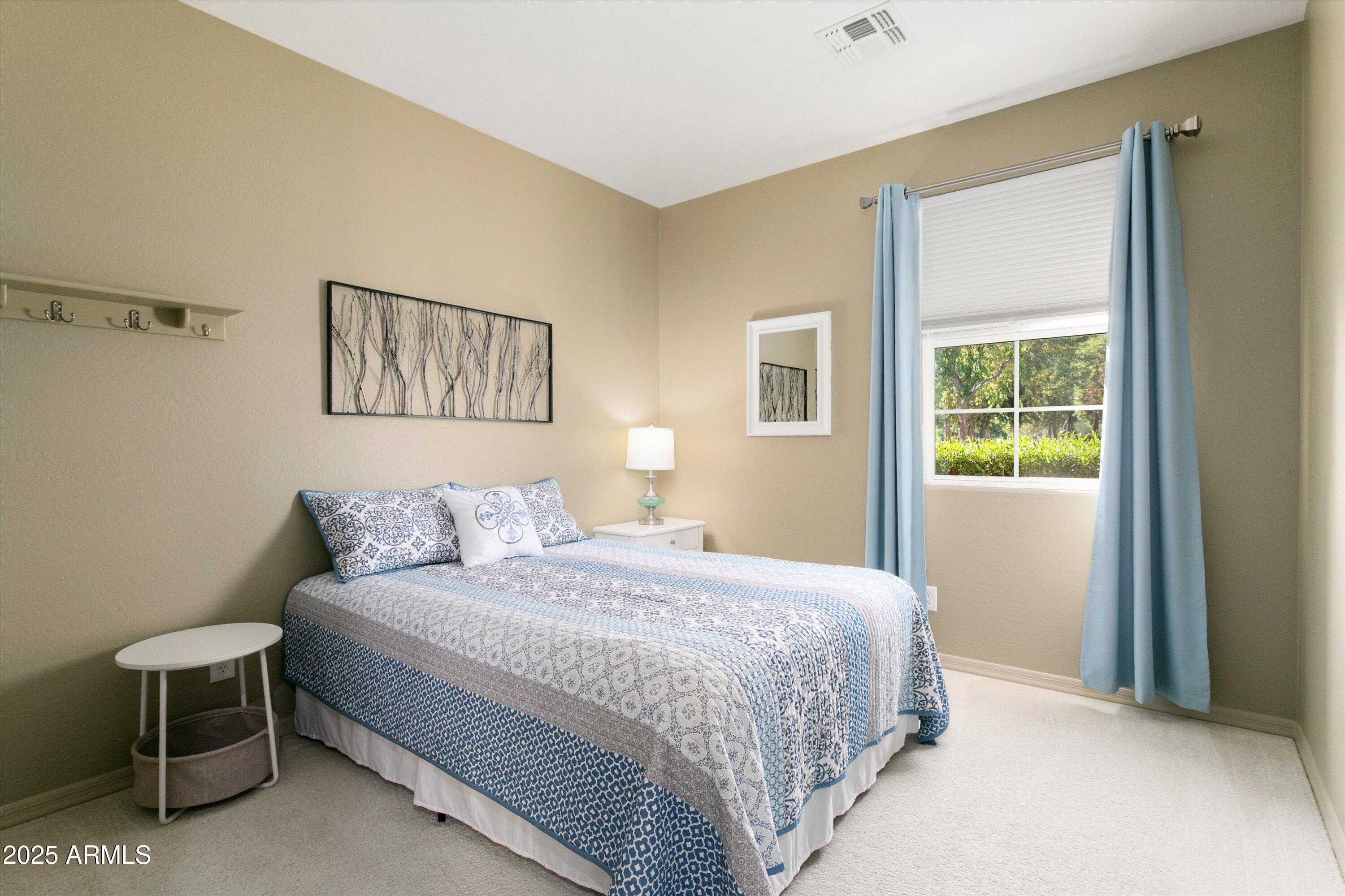 3197 North Springfield Street Buckeye, AZ 85396 - Photo 34 of 60 a bedroom with a bed and a window