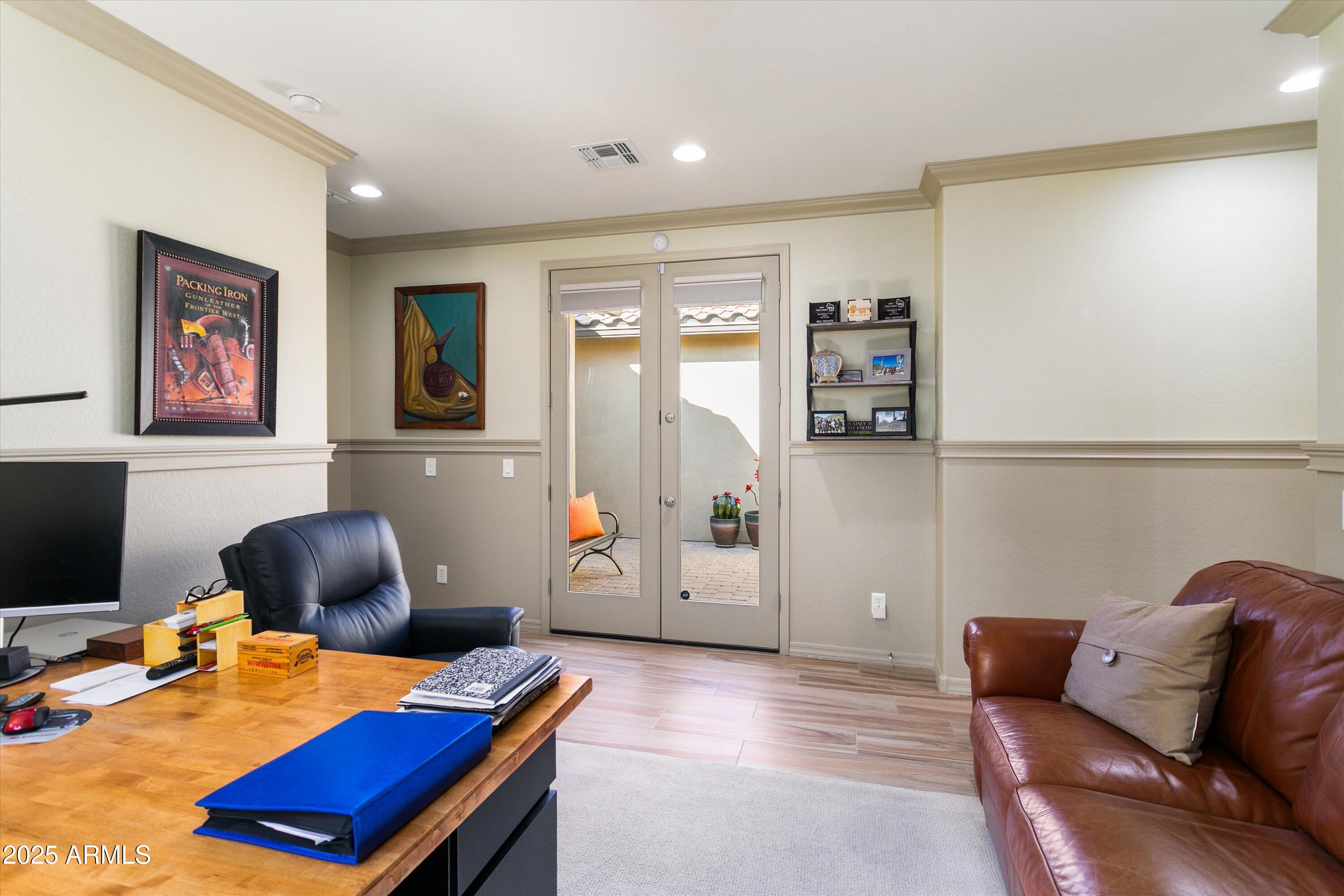 3197 North Springfield Street Buckeye, AZ 85396 - Photo 41 of 60 a workspace with furniture and book shelf