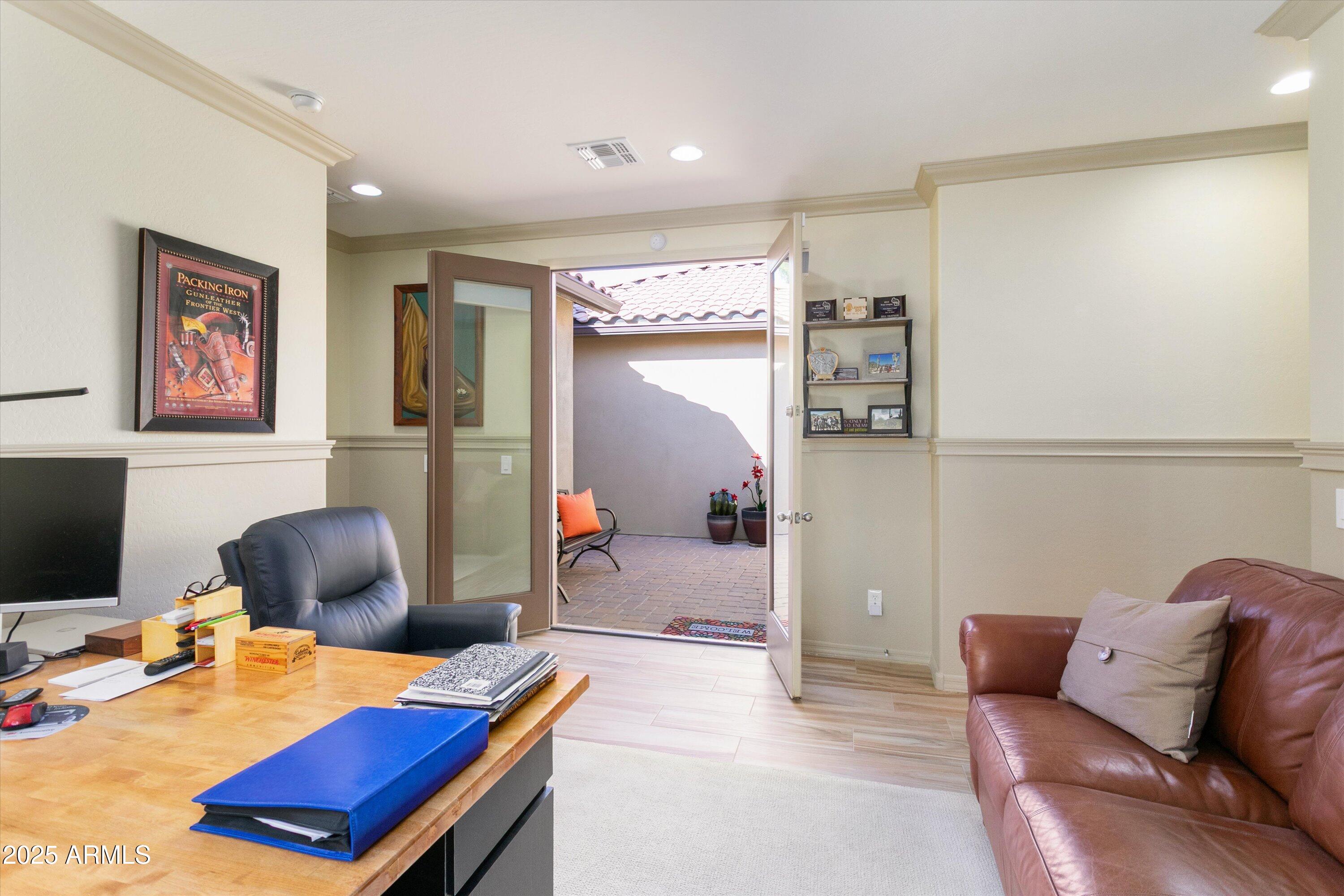 3197 North Springfield Street Buckeye, AZ 85396 - Photo 42 of 60 a bedroom with furniture and a chair