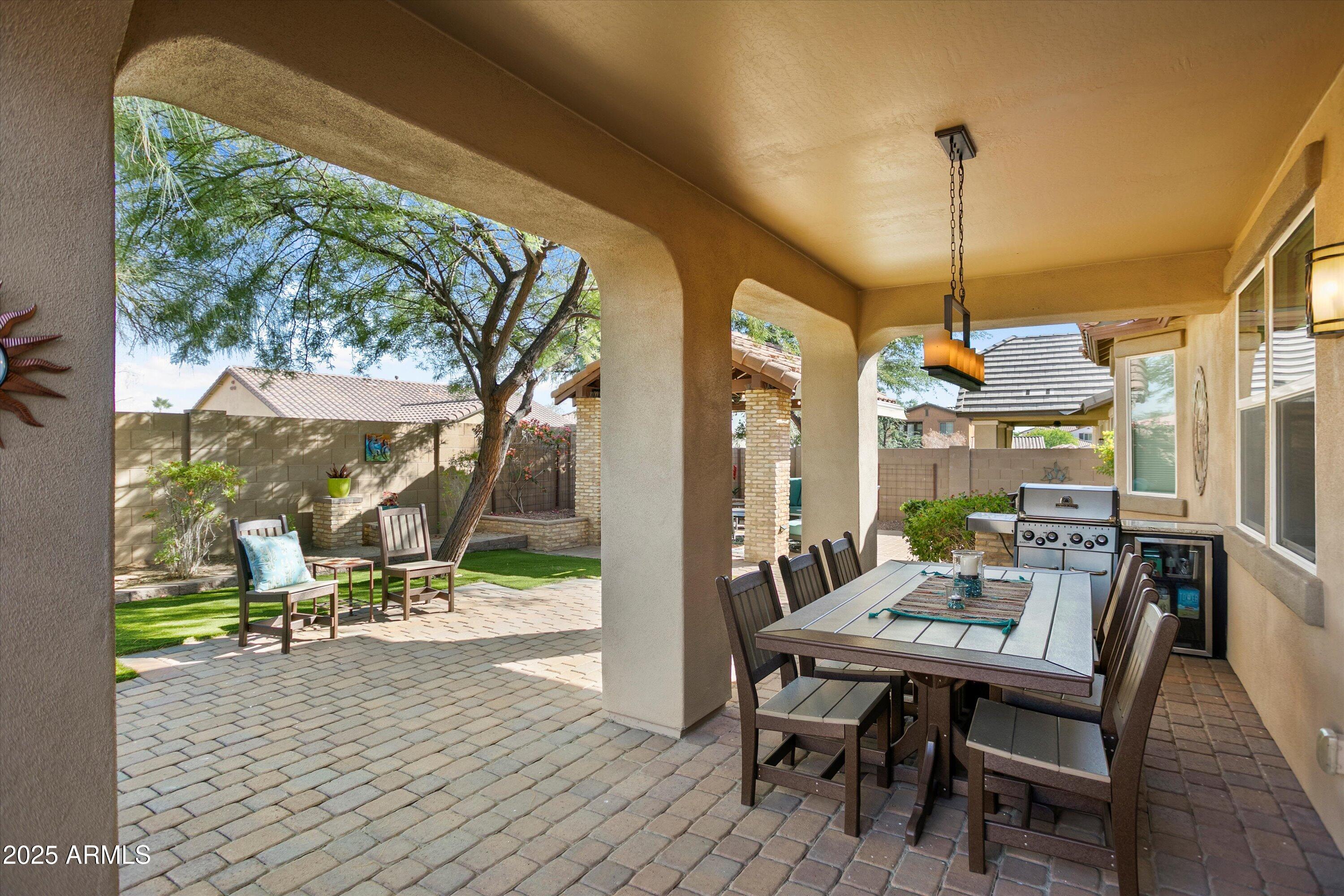 3197 North Springfield Street Buckeye, AZ 85396 - Photo 46 of 60 a view of a dining room with furniture window and wooden floor