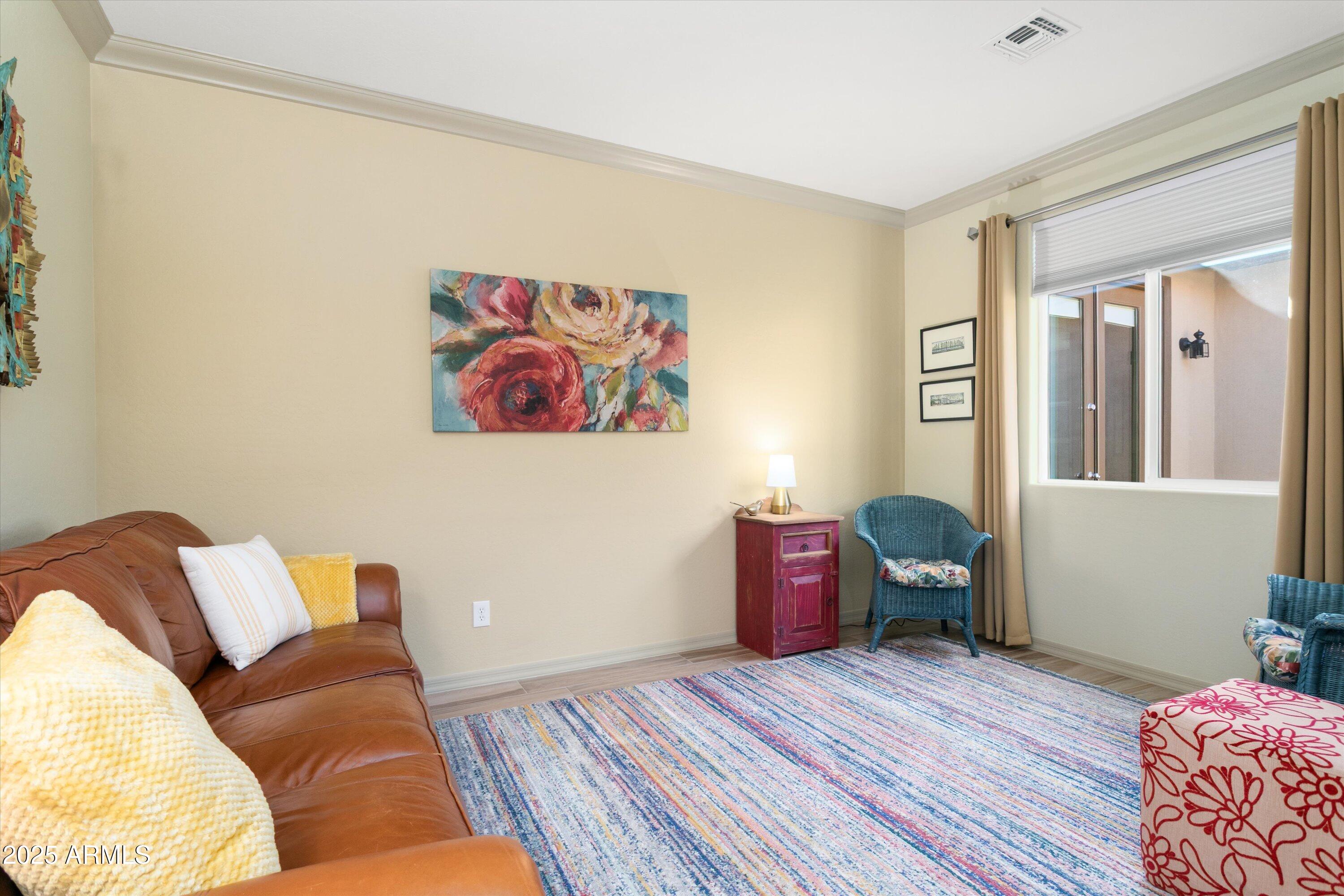 3197 North Springfield Street Buckeye, AZ 85396 - Photo 7 of 60 a living room with furniture and a window