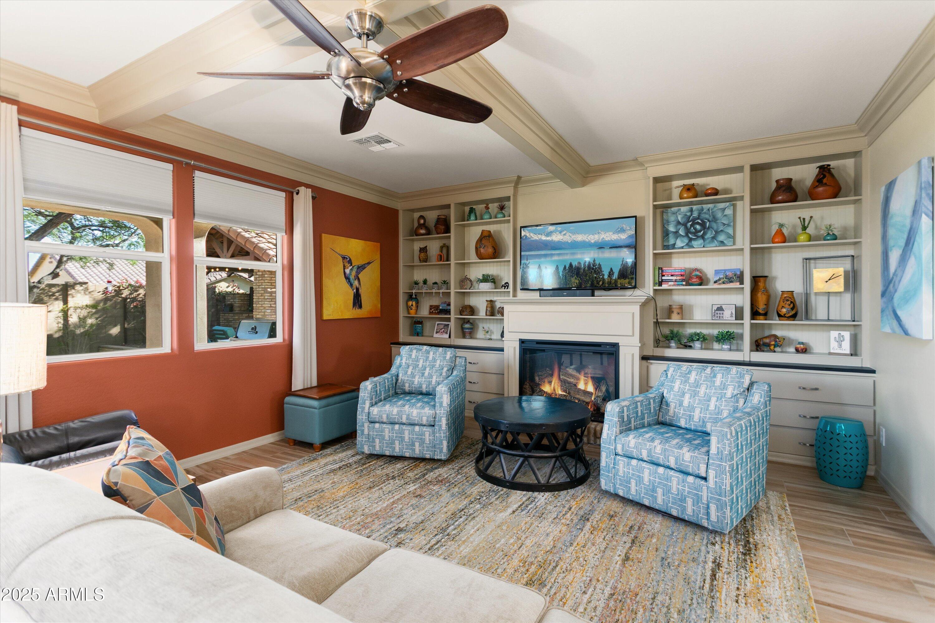 3197 North Springfield Street Buckeye, AZ 85396 - Photo 9 of 60 a living room with furniture fireplace and flat screen tv