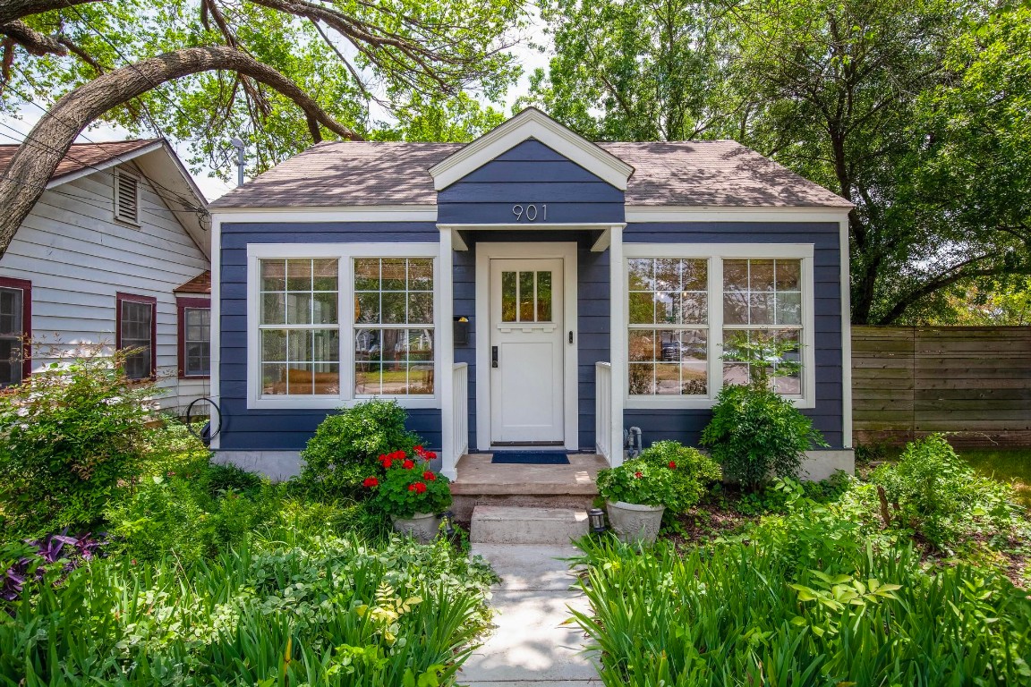 a front view of a house with garden