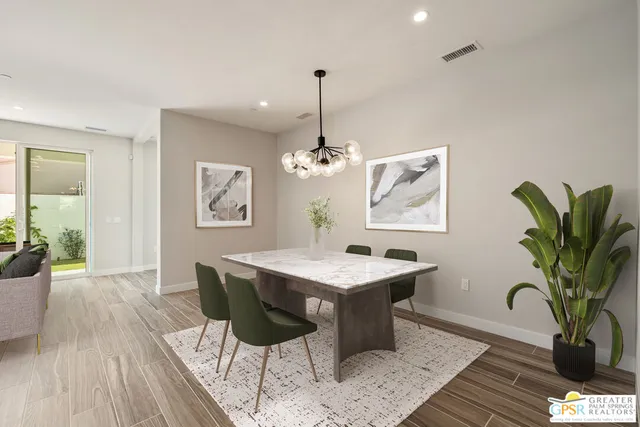 a large kitchen with lots of counter space and stainless steel appliances