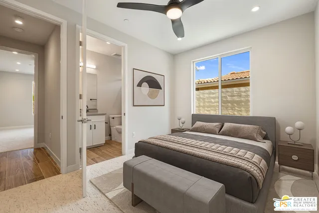 a bathroom with a toilet a sink a mirror and shower