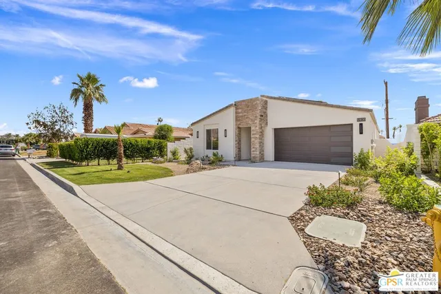 a view of front door and yard