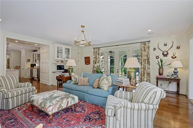 a bathroom with a sink mirror and toilet