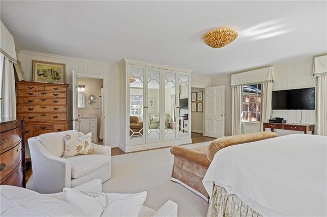 a bedroom with a bed and a cabinets