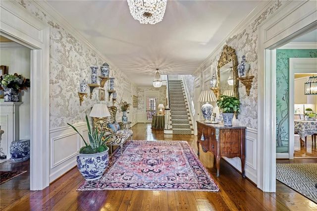 a living room filled with furniture and a table