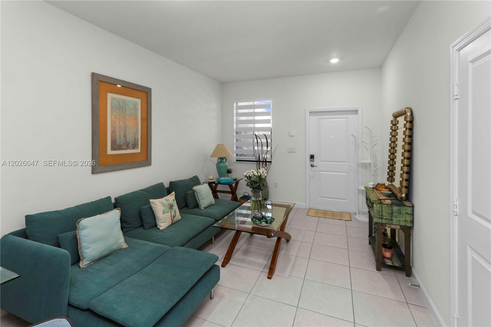 12862 Southwest 231st Street Miami, FL 33170 - Photo 6 of 30 a living room with furniture and a potted plant