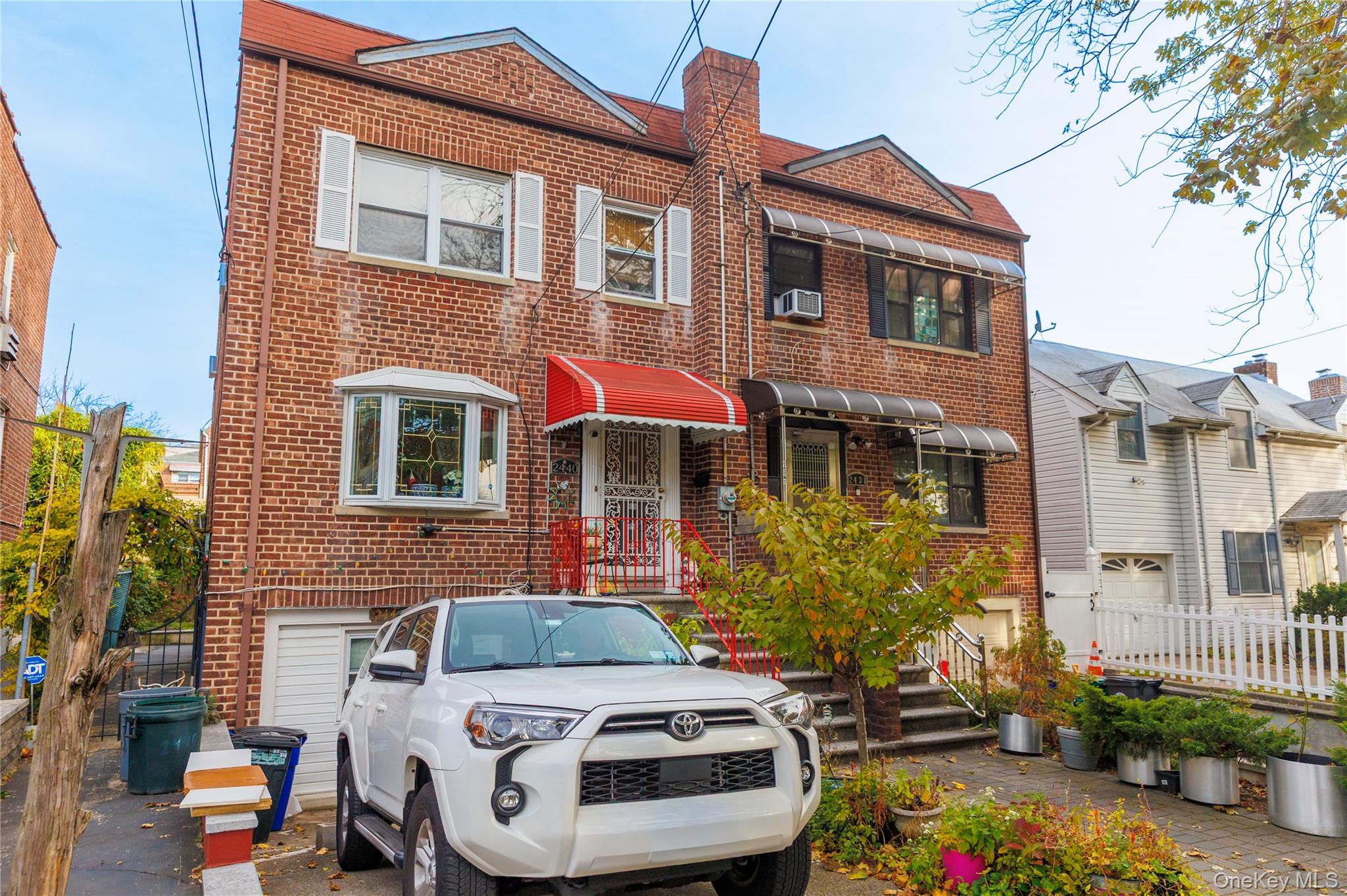 Traditional-style house featuring brick siding