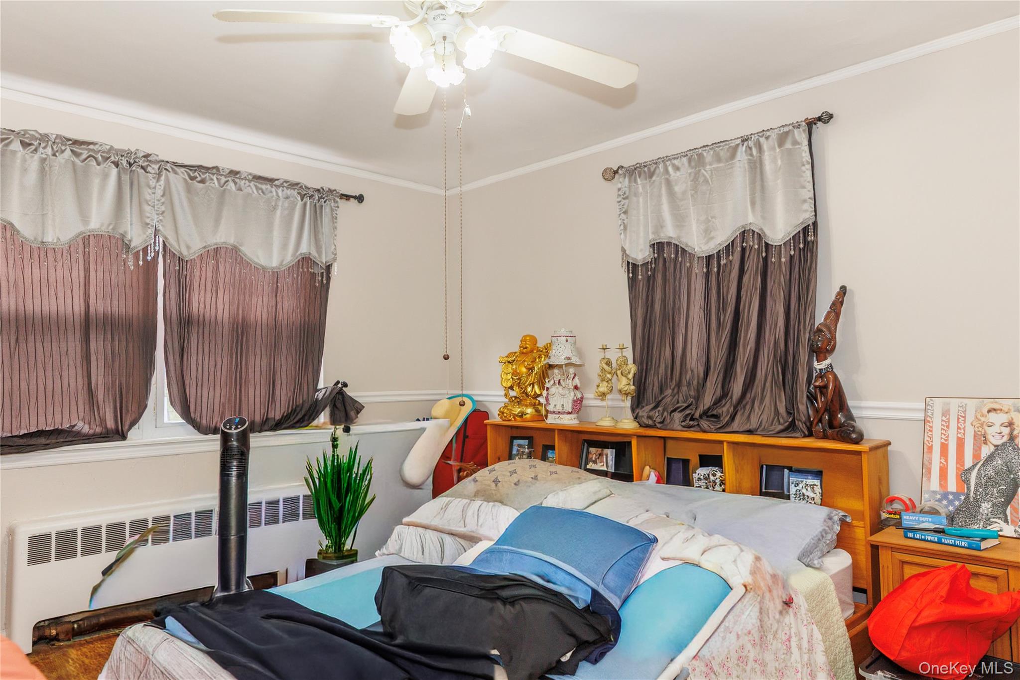 2440 Morgan Avenue Bronx, NY 10469 - Photo 11 of 23 Bedroom with radiator heating unit, ornamental molding, and ceiling fan