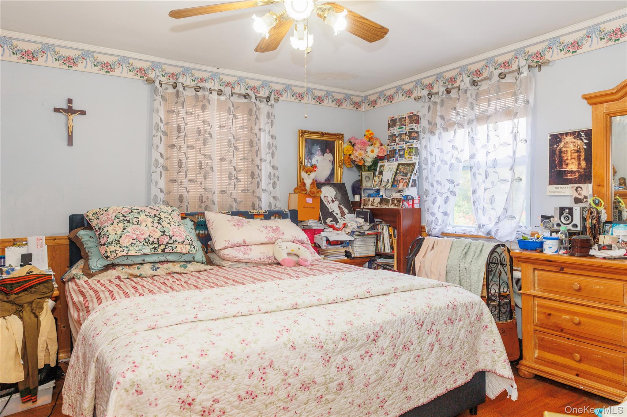 2440 Morgan Avenue Bronx, NY 10469 - Photo 12 of 23 Bedroom with ornamental molding, wood finished floors, and a ceiling fan
