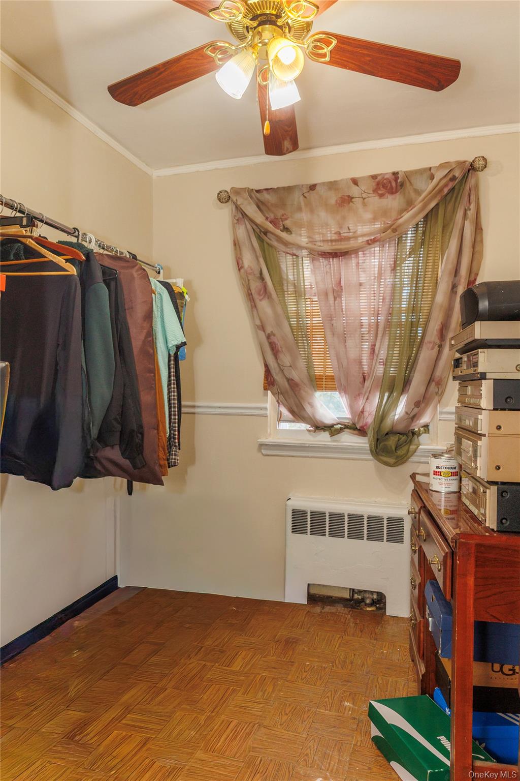 2440 Morgan Avenue Bronx, NY 10469 - Photo 14 of 23 Spacious closet with radiator and a ceiling fan