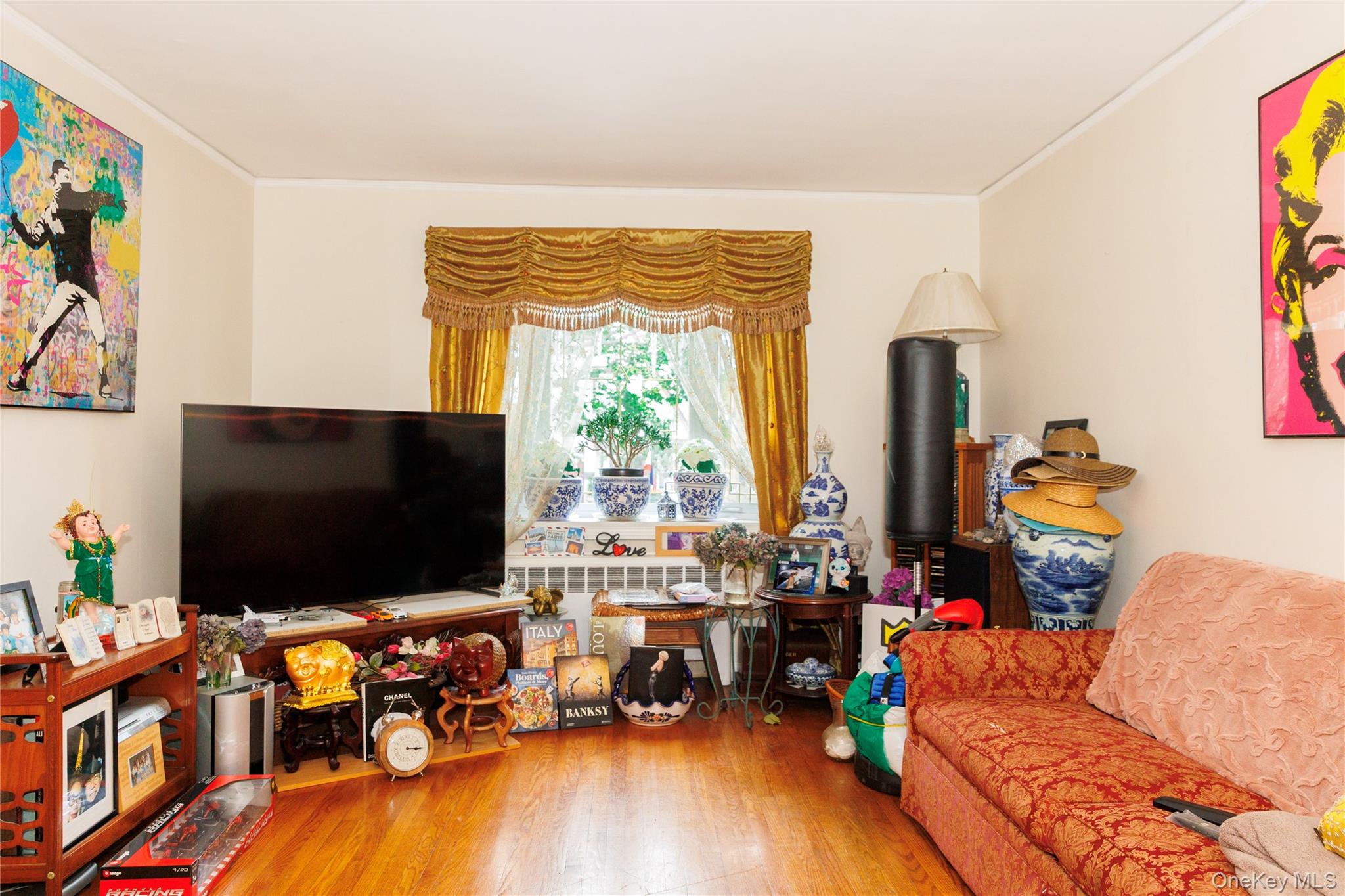 2440 Morgan Avenue Bronx, NY 10469 - Photo 5 of 23 Living room featuring wood finished floors and crown molding