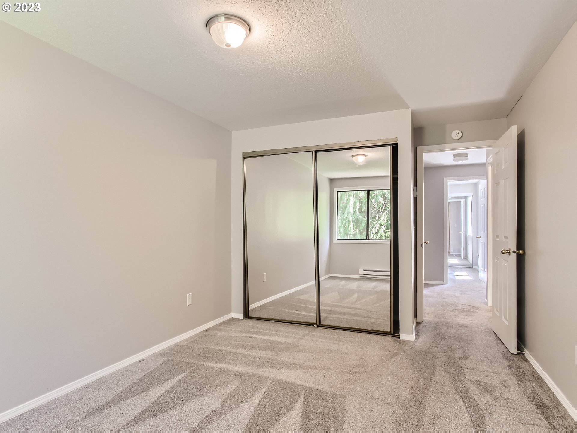 29530 Southwest Volley Street, Unit 30 Wilsonville, OR 97070 - Photo 16 of 29 an empty room with mirror and a view of bathroom