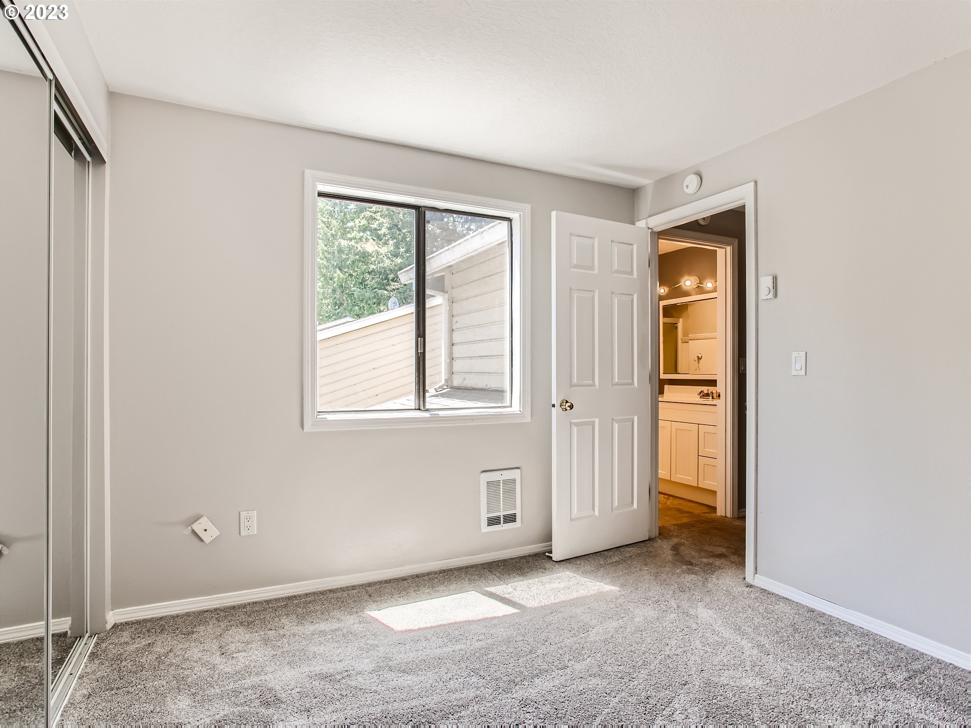 29530 Southwest Volley Street, Unit 30 Wilsonville, OR 97070 - Photo 18 of 29 a view of an empty room with closet and a window