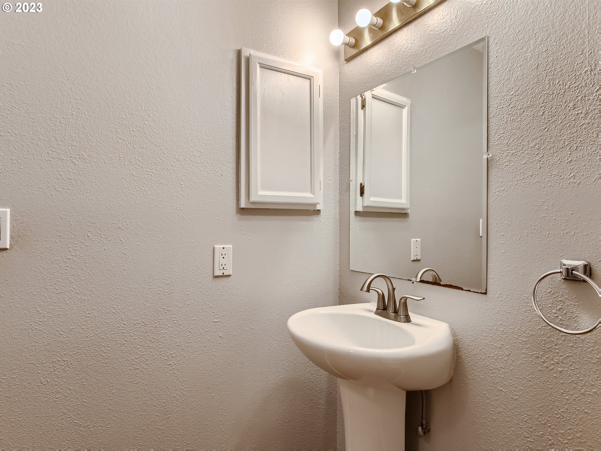 29530 Southwest Volley Street, Unit 30 Wilsonville, OR 97070 - Photo 28 of 29 a bathroom with a sink and a mirror