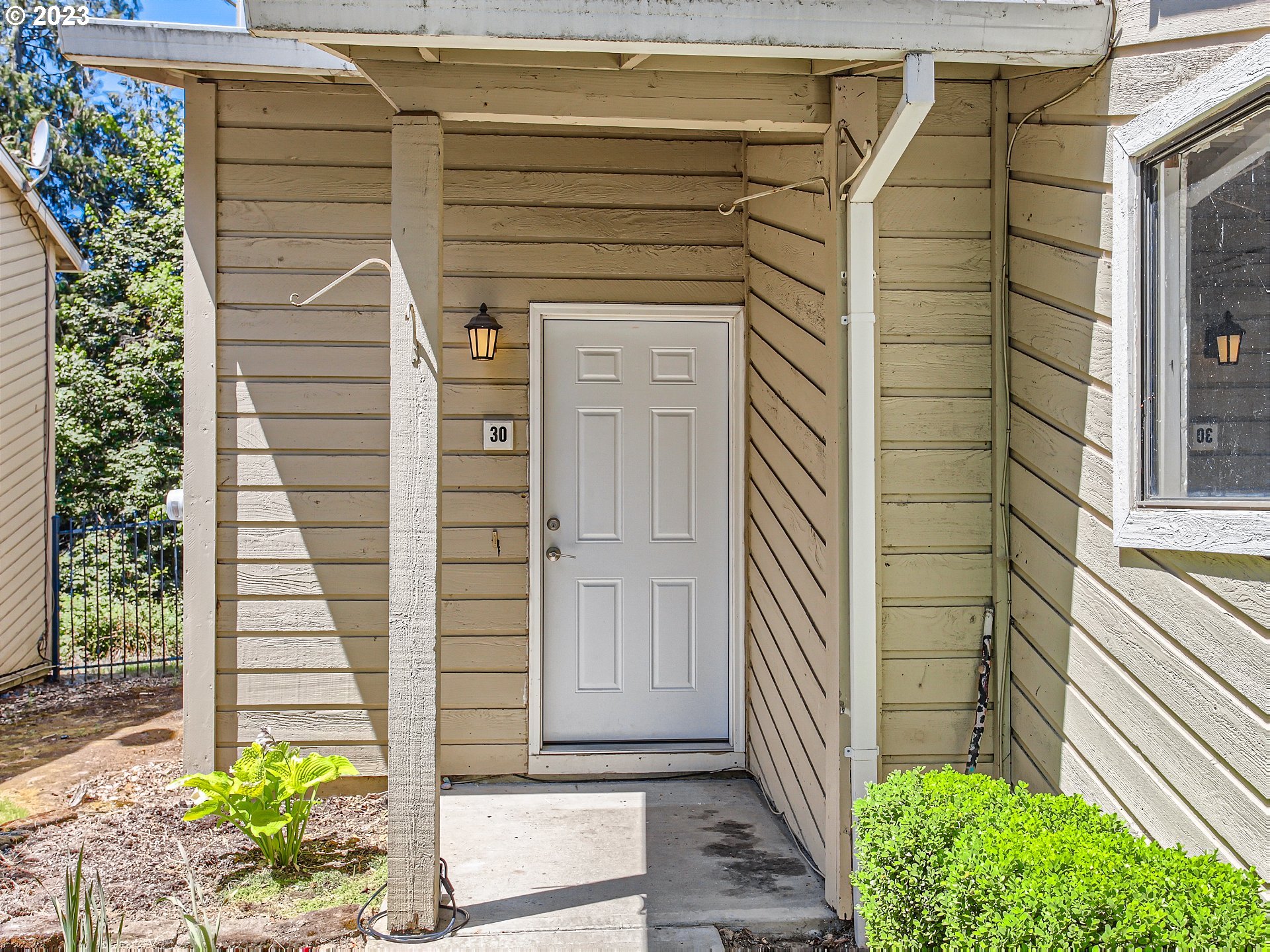29530 Southwest Volley Street, Unit 30 Wilsonville, OR 97070 - Photo 3 of 29 a front view of a house with a garage