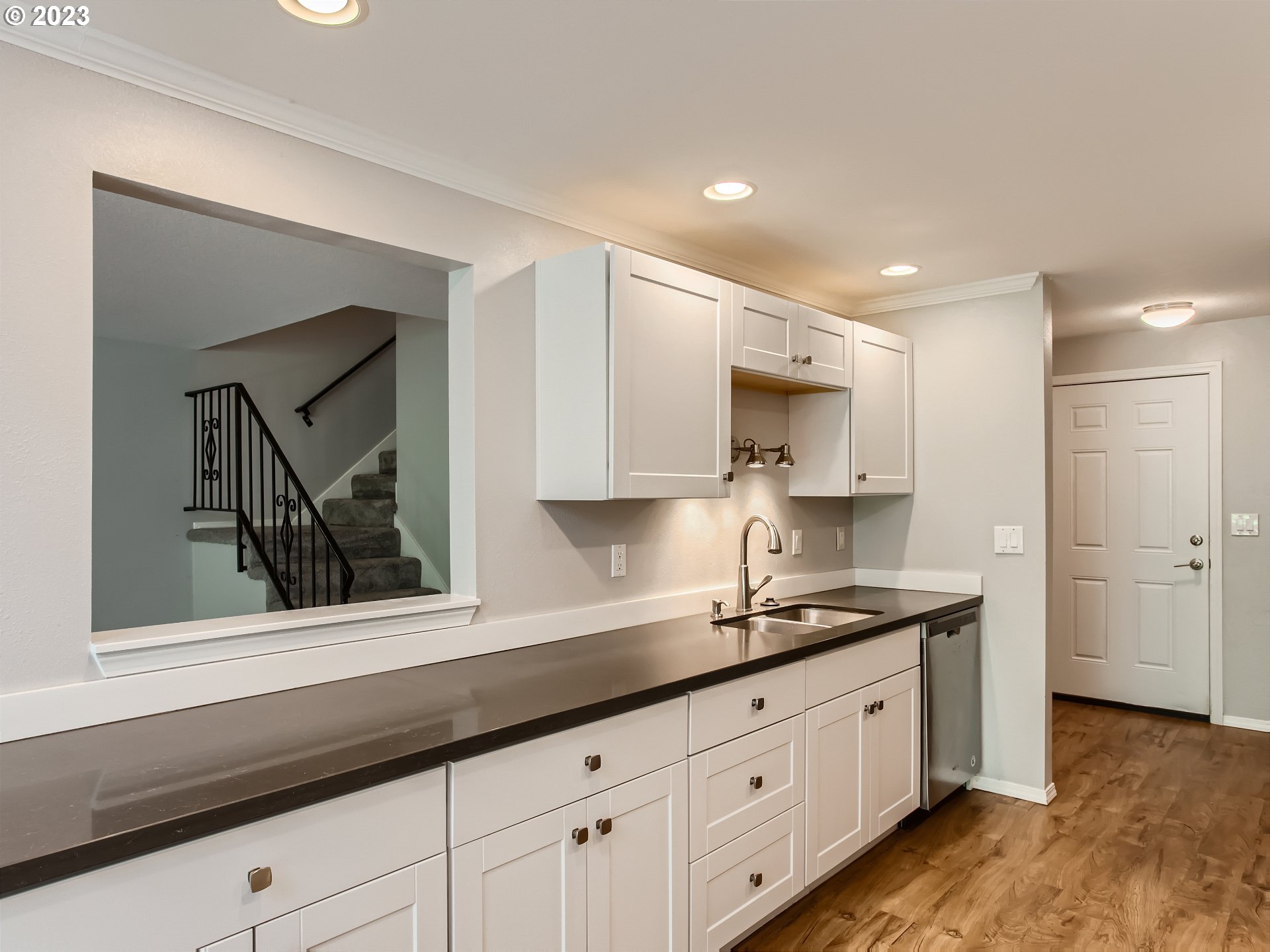 29530 Southwest Volley Street, Unit 30 Wilsonville, OR 97070 - Photo 7 of 29 a kitchen with granite countertop white cabinets and stainless steel appliances
