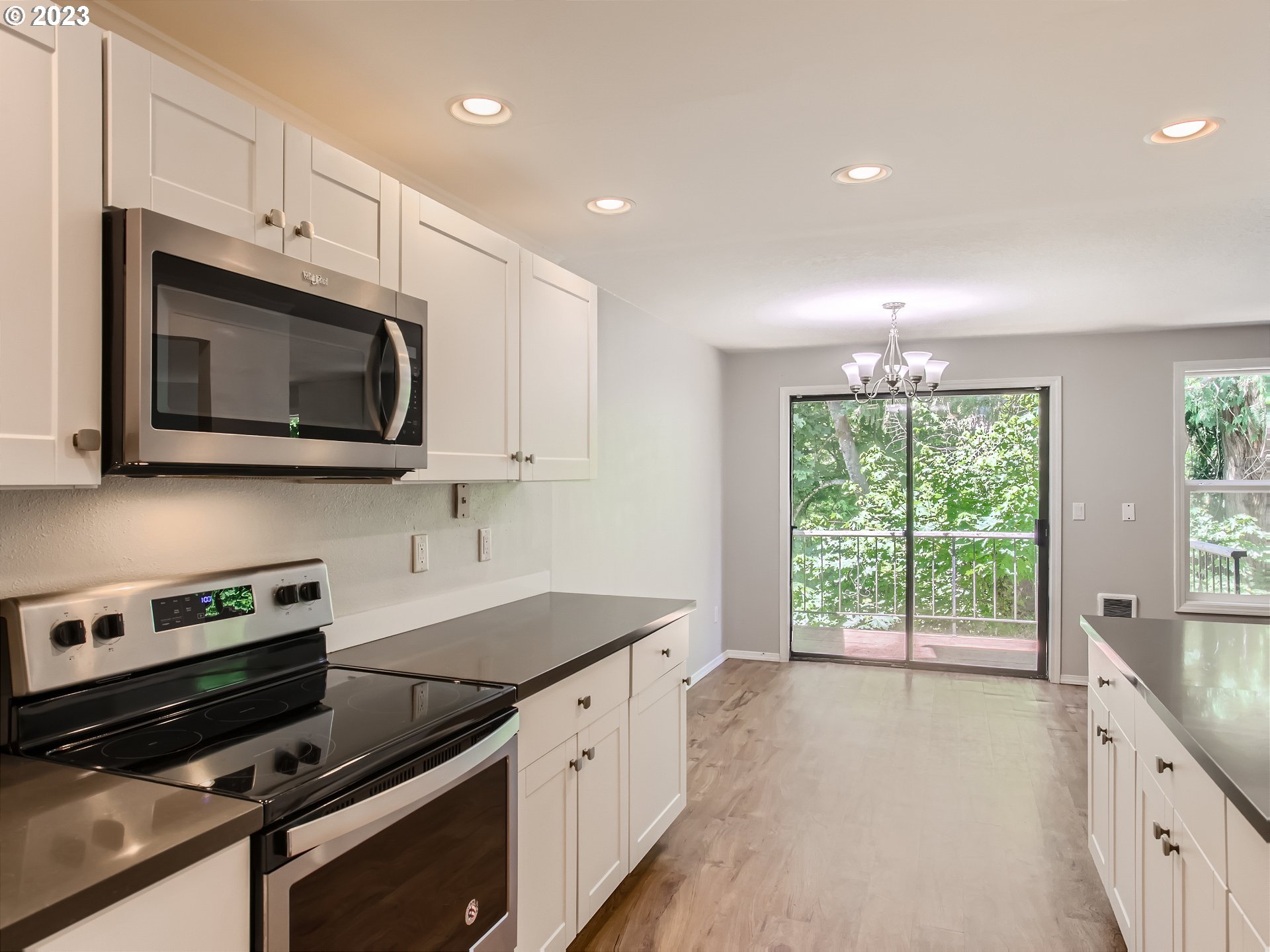 29530 Southwest Volley Street, Unit 30 Wilsonville, OR 97070 - Photo 9 of 29 a kitchen with stainless steel appliances a stove microwave and cabinets