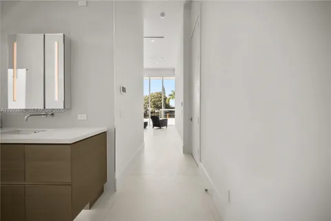a bedroom with a bed and a table
