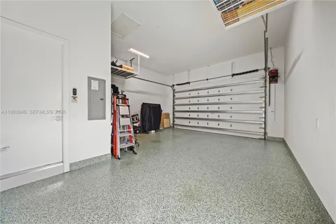 a view of a livingroom with wooden floor and door