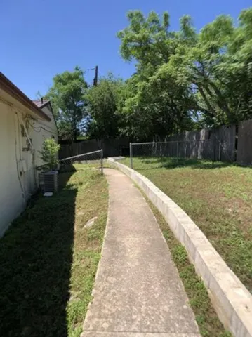 a view of swimming pool with a yard