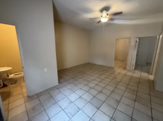 a bathroom with a shower and a toilet