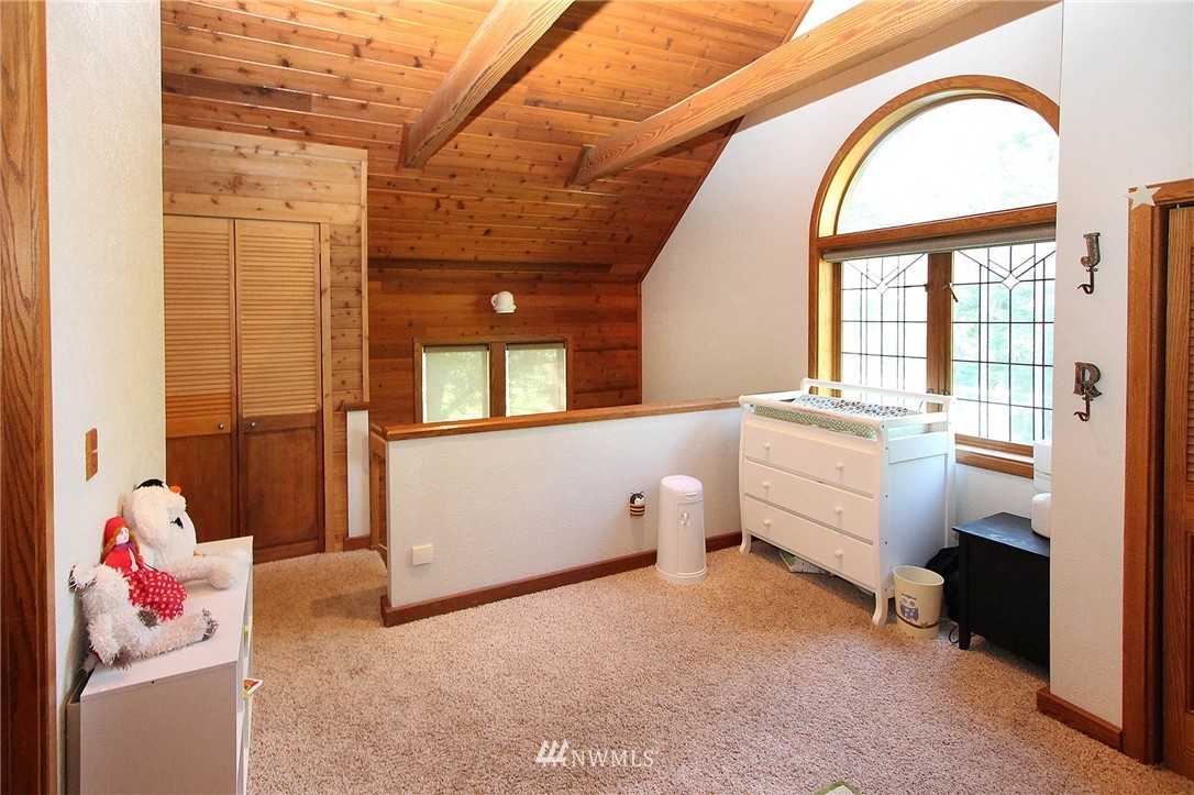 10649 Southwest Cedarhurst Road Vashon, WA 98070 - Photo 15 of 25 a room with furniture and a window