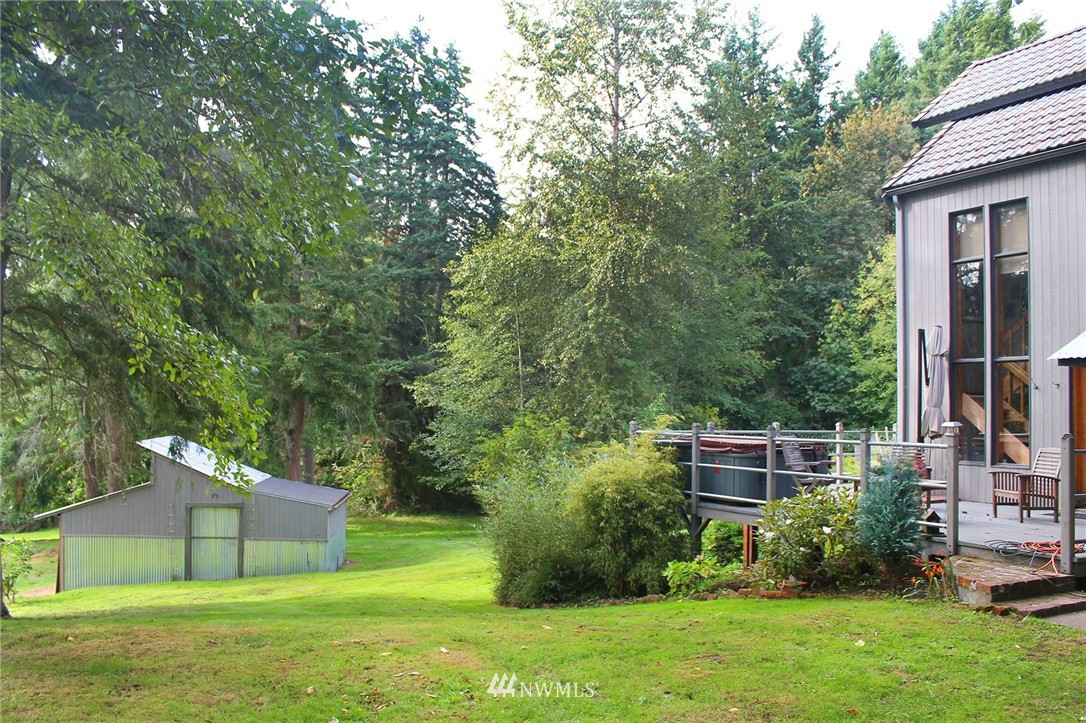10649 Southwest Cedarhurst Road Vashon, WA 98070 - Photo 18 of 25 a view of a house with a backyard