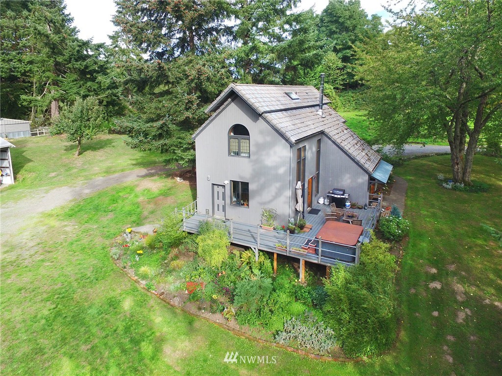 10649 Southwest Cedarhurst Road Vashon, WA 98070 - Photo 3 of 25 a view of a house with a backyard and sitting area