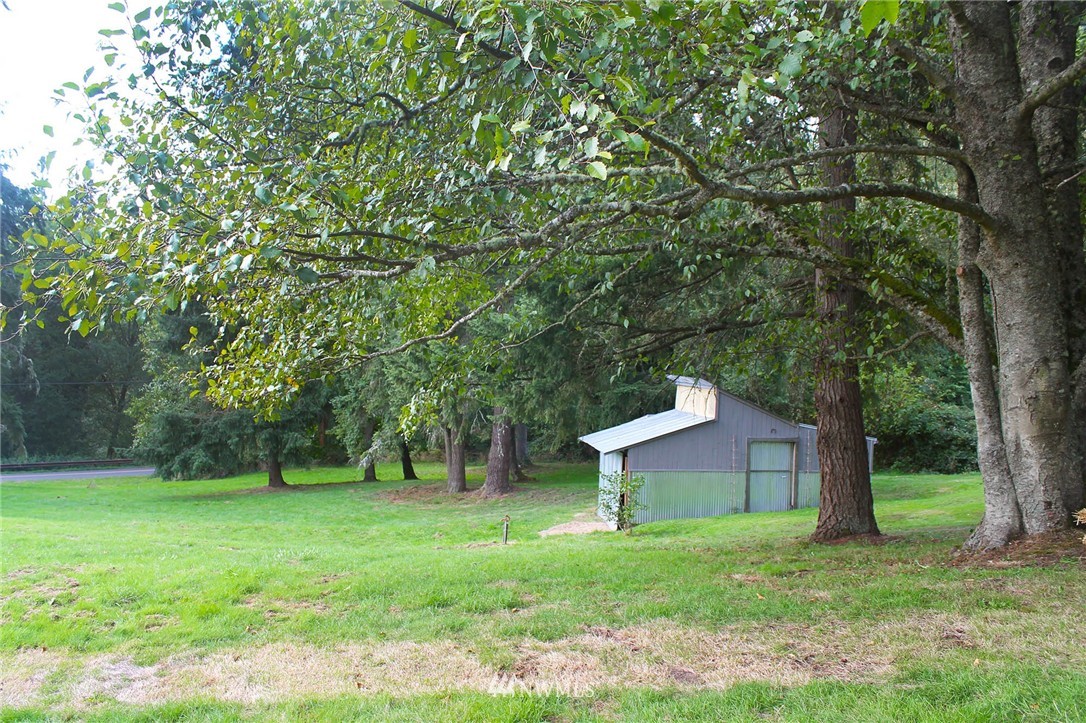 10649 Southwest Cedarhurst Road Vashon, WA 98070 - Photo 23 of 25 a view of a house with a backyard
