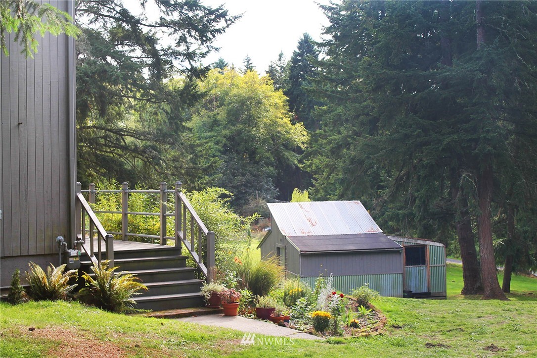 10649 Southwest Cedarhurst Road Vashon, WA 98070 - Photo 4 of 25 a view of a house with a yard