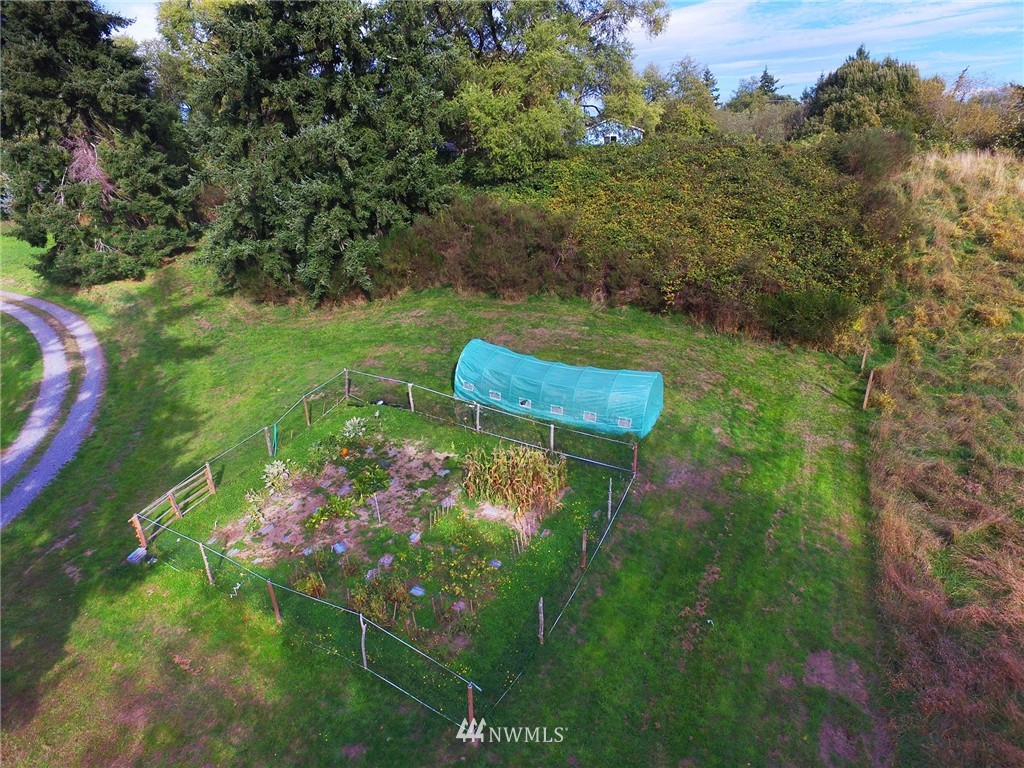 10649 Southwest Cedarhurst Road Vashon, WA 98070 - Photo 5 of 25 a backyard of a house with lots of green space