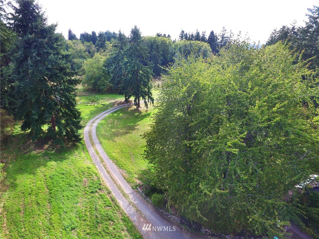 10649 Southwest Cedarhurst Road Vashon, WA 98070 - Photo 6 of 25 a view of a lake from a yard