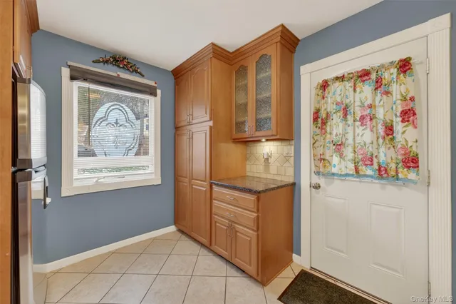 a view of front door with wooden floor