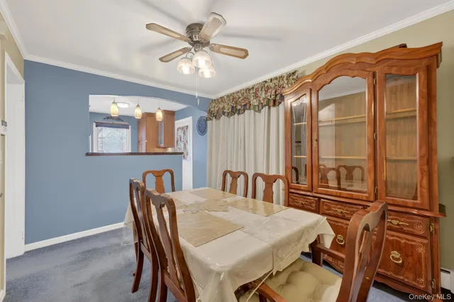 a dining room with furniture and window