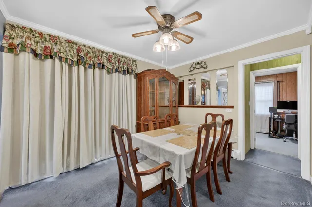 a bathroom with a granite countertop sink a toilet and a mirror
