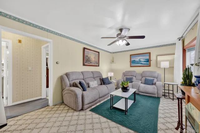 a living room with furniture and a rug