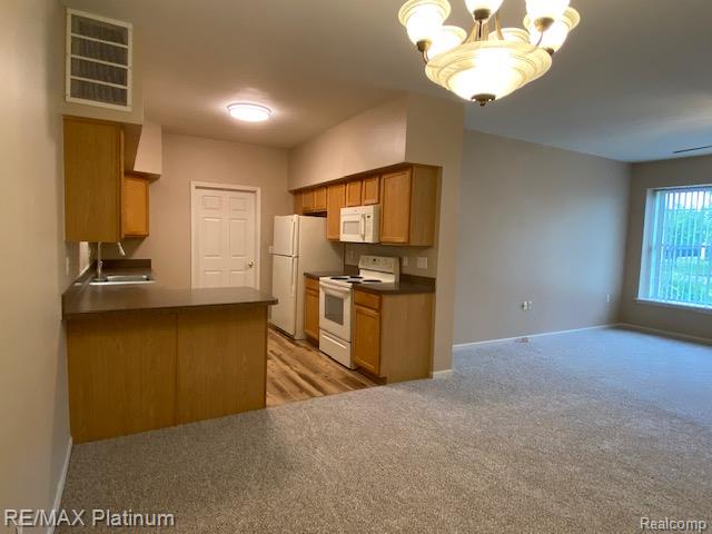1105 Rial Lake Drive, Unit 45 Howell, MI 48843 - Photo 7 of 19 View from dining area toward kitchen and living room.